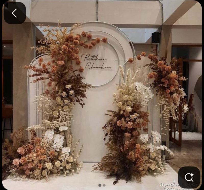 Dried floral arch with calligraphy name sign